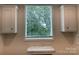 Bright laundry room with window at 126 Zircon Dr, Statesville, NC 28625