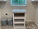 White laundry room cabinet for extra storage at 126 Zircon Dr, Statesville, NC 28625