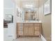 Bright bathroom featuring a wood vanity with a white countertop, mirror, and neutral wall color at 132 Ragsdale Trl, Mooresville, NC 28117