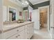 Bright bathroom featuring dual sinks, a large vanity, and a view of the shower and tub at 132 Ragsdale Trl, Mooresville, NC 28117