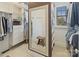 Walk-in closet provides ample storage with shelves and hanging rods; features a full-length mirror at 132 Ragsdale Trl, Mooresville, NC 28117