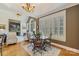 Elegant dining room with a stone fireplace, high ceilings, and large windows at 132 Ragsdale Trl, Mooresville, NC 28117