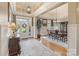 Grand foyer showcasing hardwood floors, wainscoting, and a view of the dining room at 132 Ragsdale Trl, Mooresville, NC 28117