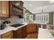 Kitchen featuring white counters, custom cabinets, tile backsplash, and stainless steel appliances at 132 Ragsdale Trl, Mooresville, NC 28117