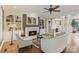 Bright living room featuring a fireplace, custom built-ins, and hardwood floors at 132 Ragsdale Trl, Mooresville, NC 28117