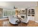 Inviting living room boasts a cozy fireplace, custom built-ins, and elegant hardwood floors at 132 Ragsdale Trl, Mooresville, NC 28117