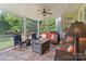 Inviting covered patio with comfortable seating and a cozy fire pit for outdoor relaxation at 132 Ragsdale Trl, Mooresville, NC 28117