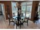 Elegant dining room bathed in natural light, adorned with decorative chandelier and refined table setting at 1330 Millview Ln, Matthews, NC 28104