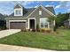 Charming home featuring craftsman architecture, a lush front lawn, and a two car garage at 1330 Millview Ln, Matthews, NC 28104