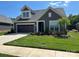 Charming home featuring manicured lawn, attached garage, and Craftsman-style detailing for a welcoming curb appeal at 1330 Millview Ln, Matthews, NC 28104