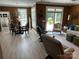 Open-concept space seamlessly connecting dining, living areas, and patio access for an inviting atmosphere at 1330 Millview Ln, Matthews, NC 28104