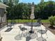 Outdoor patio with dining setup and a manicured lawn, ideal for entertaining and relaxing in serene outdoor space at 1330 Millview Ln, Matthews, NC 28104