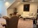 Inviting sitting room features plush seating, soft lighting, and warm ambiance, perfect for relaxation and conversation at 1330 Millview Ln, Matthews, NC 28104