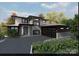 Modern home with a two-car garage, stone accents, and a sleek, flat roof design at 138 Broken Arrow Rd, Statesville, NC 28677