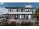 Modern two-story home with large windows and outdoor patio at 138 Broken Arrow Rd, Statesville, NC 28677