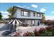 Modern two-story home with large windows and outdoor patio at 138 Broken Arrow Rd, Statesville, NC 28677