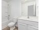 This bathroom features a vanity with storage, toilet, and shower/tub combination at 1404 Waylon Ave, Gastonia, NC 28054