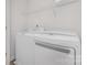 Laundry room featuring a side by side washer and dryer unit and overhead storage at 1404 Waylon Ave, Gastonia, NC 28054
