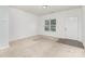 Inviting living room with new carpeting, fresh neutral paint, and natural light at 1404 Waylon Ave, Gastonia, NC 28054