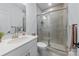 Modern bathroom with glass-enclosed shower, stylish vanity, and neutral color palette at 14116 Glaswick Dr, Charlotte, NC 28278