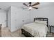 Bright bedroom featuring carpet, a ceiling fan, and large closet at 14116 Glaswick Dr, Charlotte, NC 28278
