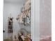 Walk-in closet with ample storage, including shelves, hanging rods, and organized accessories at 14116 Glaswick Dr, Charlotte, NC 28278