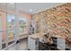 Bright home office with floral wallpaper, desk, shelving, and lots of natural light at 14116 Glaswick Dr, Charlotte, NC 28278