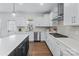 Well-appointed kitchen featuring sleek appliances, generous counter space, and contemporary design for culinary enthusiasts at 14116 Glaswick Dr, Charlotte, NC 28278