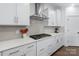 Contemporary kitchen equipped with modern appliances, perfect for cooking and gatherings, features a gas cooktop at 14116 Glaswick Dr, Charlotte, NC 28278