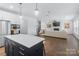 Bright, open-concept living space with modern finishes and a beautiful kitchen island at 14116 Glaswick Dr, Charlotte, NC 28278