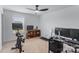 Bright home office setup with desk, treadmill, bike, and plenty of space at 14116 Glaswick Dr, Charlotte, NC 28278