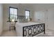 Bright bedroom with a patterned metal bed frame and natural light at 1427 Main St, Charlotte, NC 28204