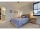 Serene bedroom with a comfortable bed and natural wood nightstands at 1427 Main St, Charlotte, NC 28204