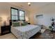 Comfortable bedroom with a ceiling fan, dark wood flooring, and lots of natural light at 1427 Main St, Charlotte, NC 28204