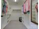 Bright walk-in closet with built-in shelving and plenty of storage space for clothes and accessories at 1427 Main St, Charlotte, NC 28204
