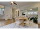 Well lit dining area with hardwood floors, round table, and open view to the living area at 1427 Main St, Charlotte, NC 28204