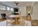 Open dining area featuring hardwood floors, a round table, and natural light at 1427 Main St, Charlotte, NC 28204
