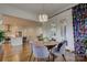 Elegant dining area with hardwood floors and seamless flow into the living room and adjacent outdoor area at 1427 Main St, Charlotte, NC 28204