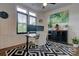 Bright home office featuring modern desk setup, patterned rug, and stylish decor at 1427 Main St, Charlotte, NC 28204
