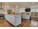 Spacious kitchen featuring a large island, stainless steel appliances, and seamless flow into the adjacent living area at 1427 Main St, Charlotte, NC 28204