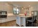 Modern kitchen featuring white cabinets, stainless steel appliances, granite countertops, and a large island at 1427 Main St, Charlotte, NC 28204