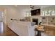 Inviting living room featuring a cozy fireplace, built-in shelving, hardwood floors, and ample natural light at 1427 Main St, Charlotte, NC 28204