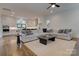Bright and airy living room with hardwood floors, a comfortable sofa, and seamless access to the modern kitchen at 1427 Main St, Charlotte, NC 28204