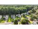 An aerial view of the home showcasing the front yard and surrounding greenery in the neighborhood at 1445 Deer Forest Dr, Indian Land, SC 29707