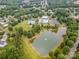 Aerial view of the community with community center, pool, tennis courts and a pond at 1445 Deer Forest Dr, Indian Land, SC 29707
