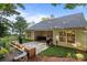 Charming backyard featuring a patio, built in seating and a beautifully landscaped area, perfect for relaxation at 1445 Deer Forest Dr, Indian Land, SC 29707