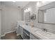 Bright bathroom featuring double sinks with white countertops and modern fixtures at 1445 Deer Forest Dr, Indian Land, SC 29707