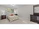 Comfortable bedroom with carpet flooring, dresser and good light at 1445 Deer Forest Dr, Indian Land, SC 29707