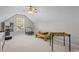 Finished bonus room with a ceiling fan, trampoline, and foosball table at 1445 Deer Forest Dr, Indian Land, SC 29707