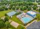Aerial view of community pool, tennis courts, playground, and parking area at 1445 Deer Forest Dr, Indian Land, SC 29707